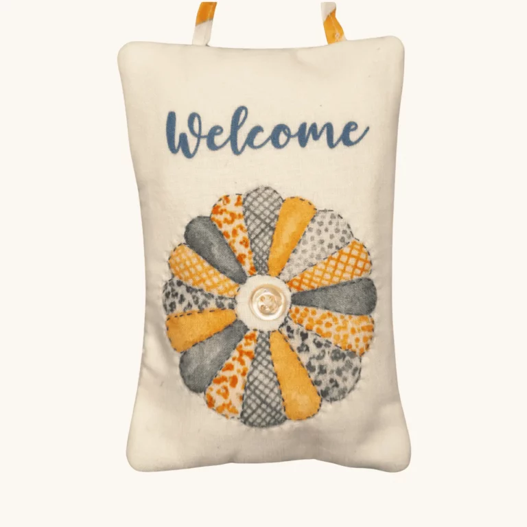 A completed Quilting Time Doorknob pillow by the Posy Collection