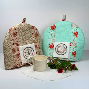 An embroidered Summer and Floral Vintage Tea Cozy set from the Posy Collection.