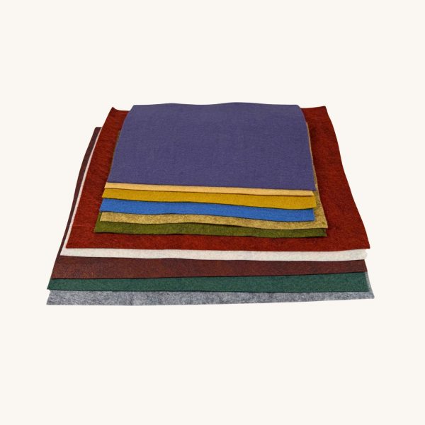 Wool felt pieces are folded and displayed on a table.