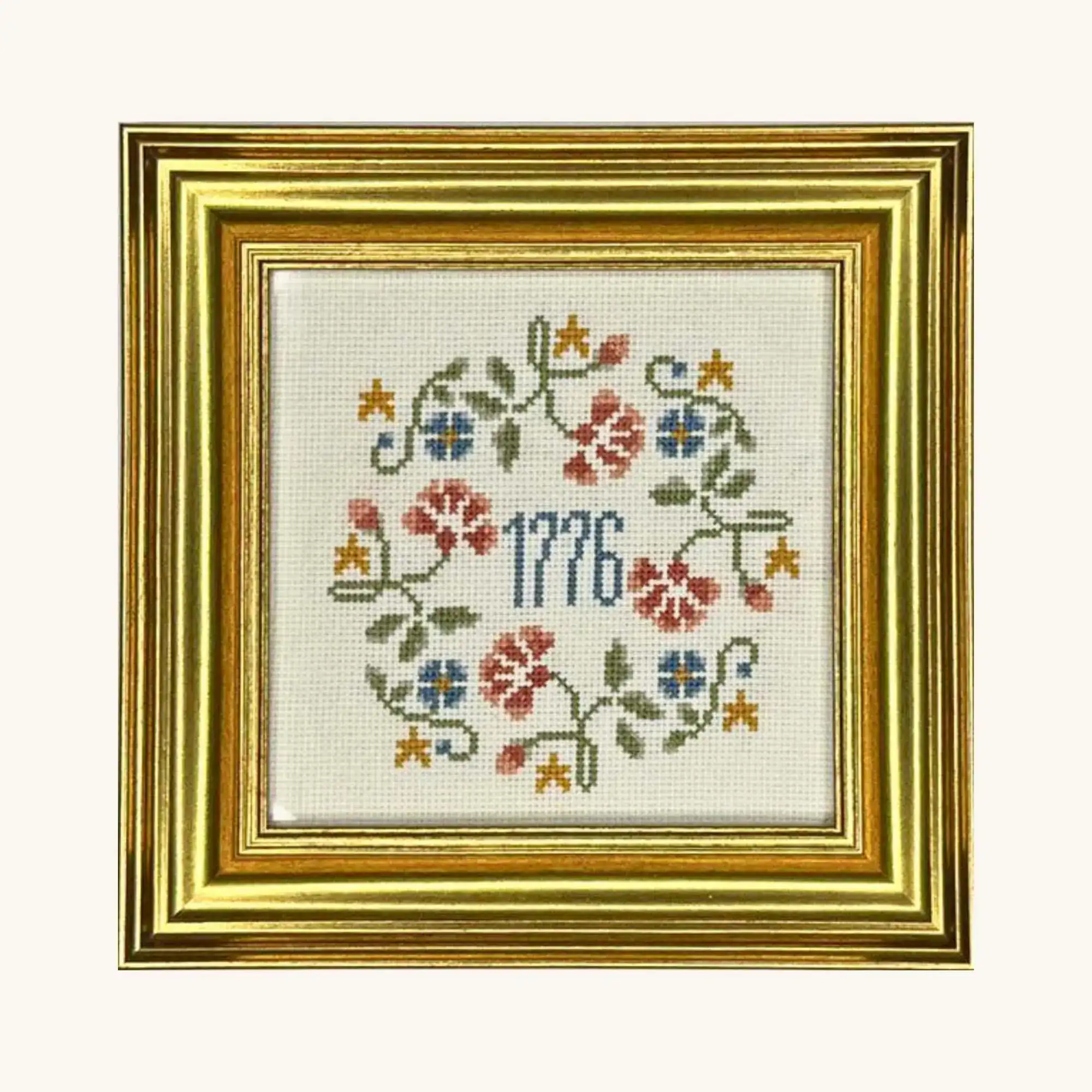 Completed floral 1776 wreath counted cross stitch kit from the Posy Collection.